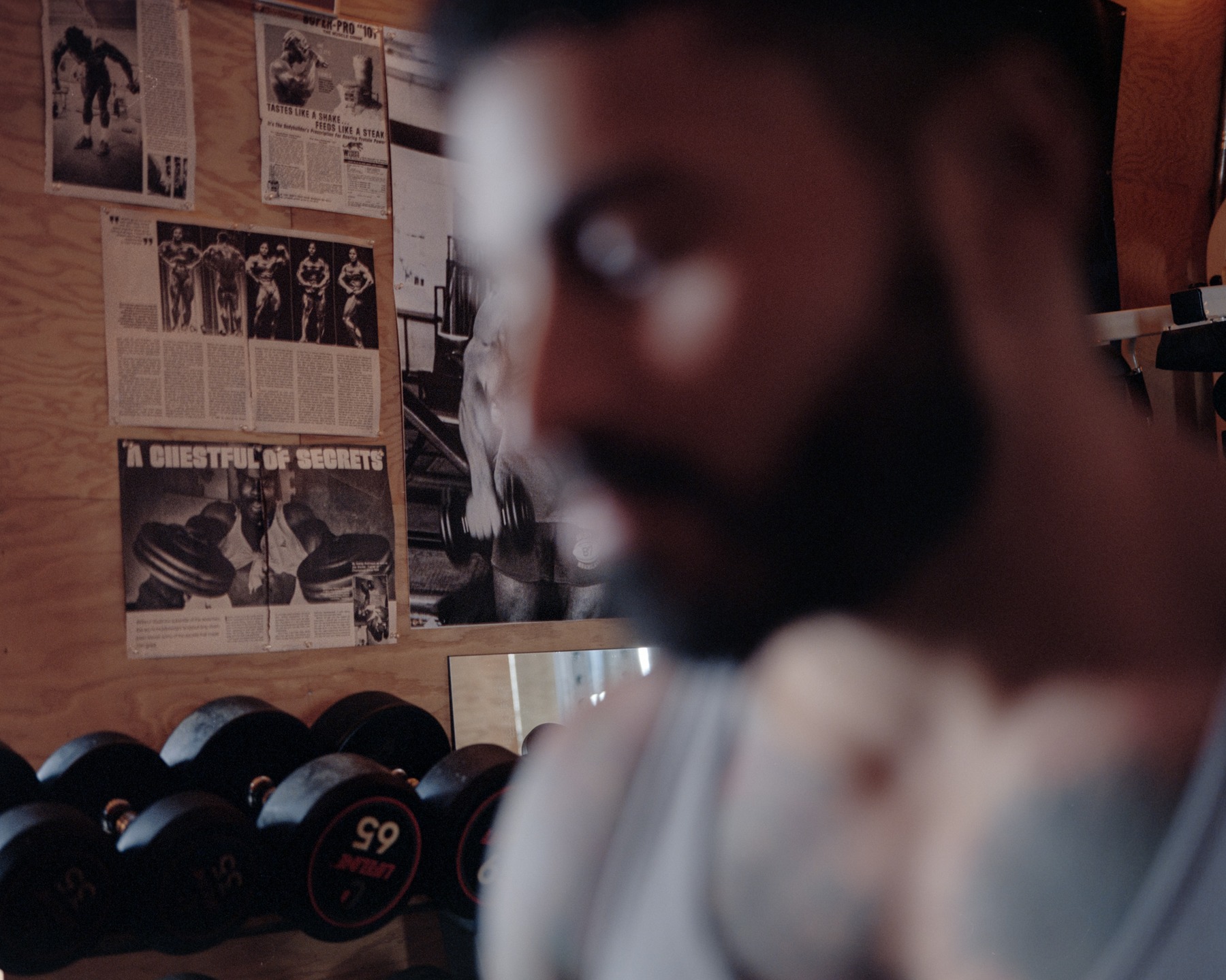 A softly focused portrait of a bearded man indoors