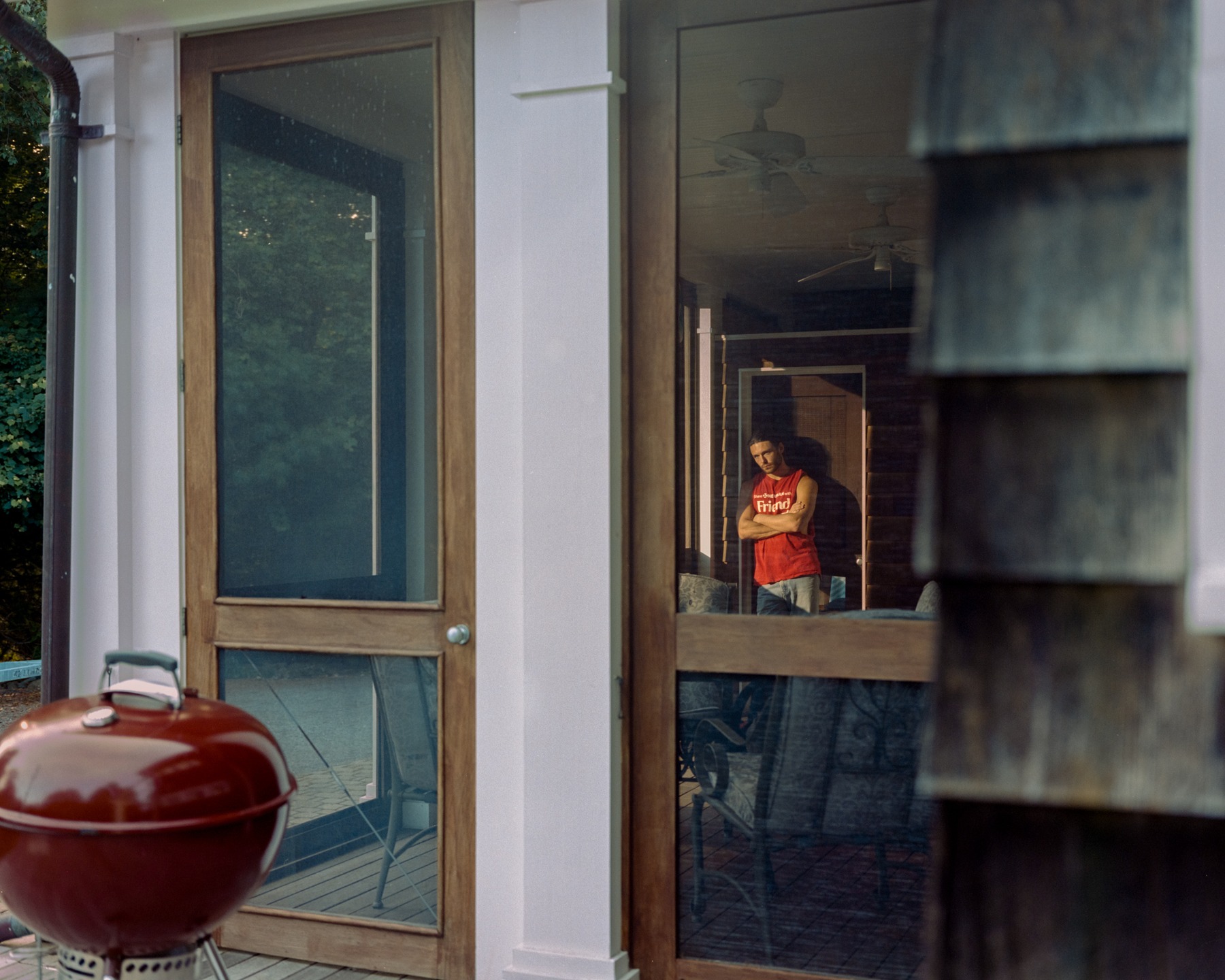 A child standing in a dark doorway